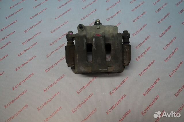 Nissan 41001-WF100 Суппорт тормозной правый